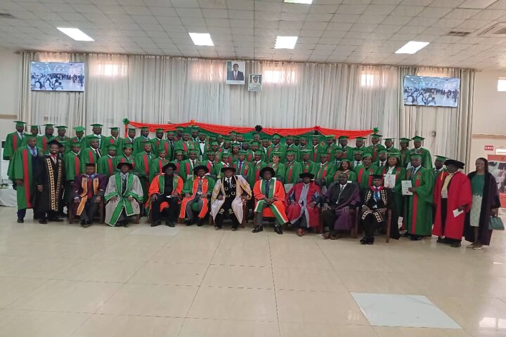 DVC poses for a photo with graduates